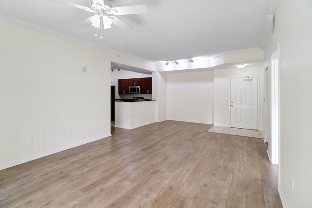 unfurnished living room with baseboards, light wood finished floors, a ceiling fan, and crown molding