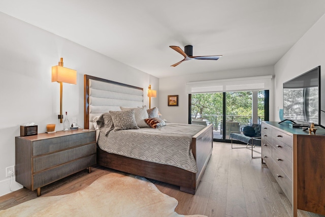 bedroom featuring ceiling fan, light hardwood / wood-style floors, and access to outside