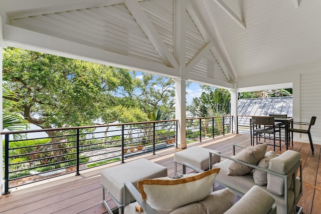 wooden terrace with an outdoor hangout area