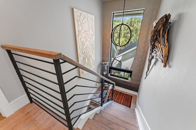 stairway featuring hardwood / wood-style flooring