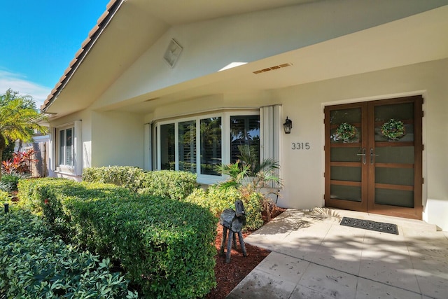 view of exterior entry with french doors