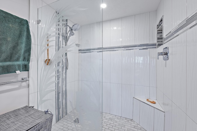 bathroom with a tile shower