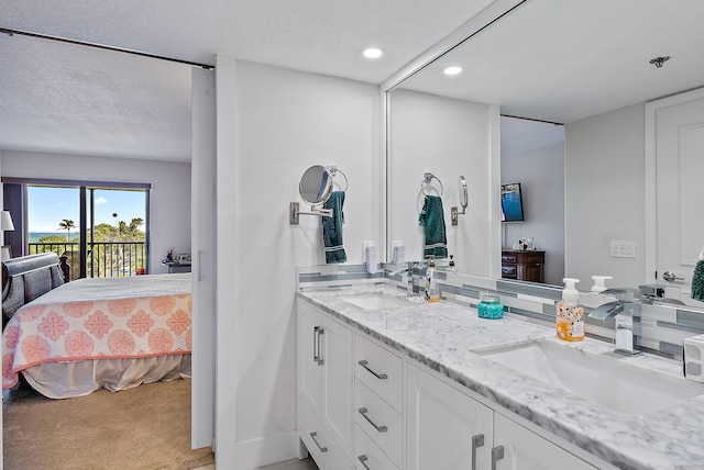 bathroom featuring vanity and a textured ceiling