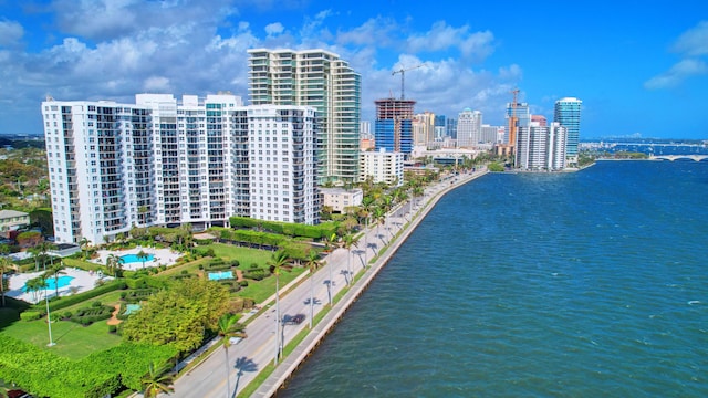 birds eye view of property with a water view