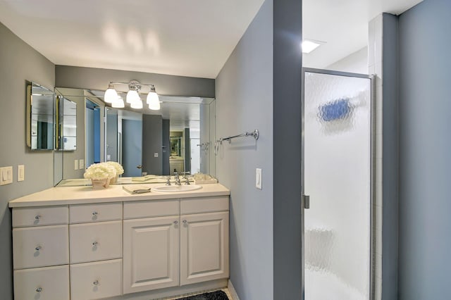 bathroom with vanity and an enclosed shower