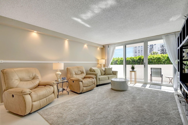 living room with a textured ceiling and expansive windows