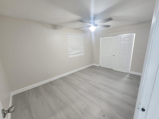 unfurnished bedroom featuring a closet, ceiling fan, and light hardwood / wood-style flooring