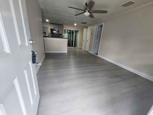 interior space featuring hardwood / wood-style floors and ceiling fan