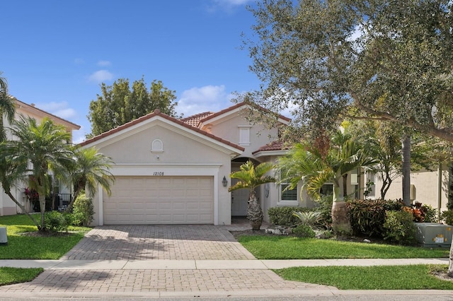 mediterranean / spanish-style home featuring a garage