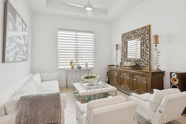 living room with ceiling fan, a healthy amount of sunlight, light tile patterned floors, and crown molding