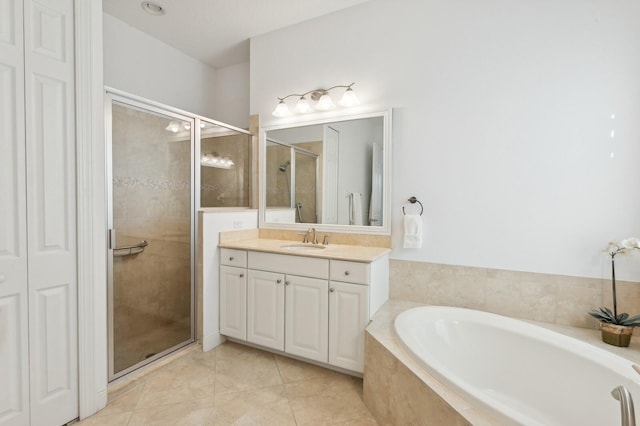 bathroom featuring separate shower and tub, tile patterned flooring, and vanity