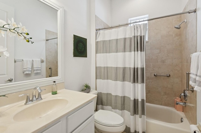 full bathroom featuring vanity, shower / bath combination with curtain, and toilet