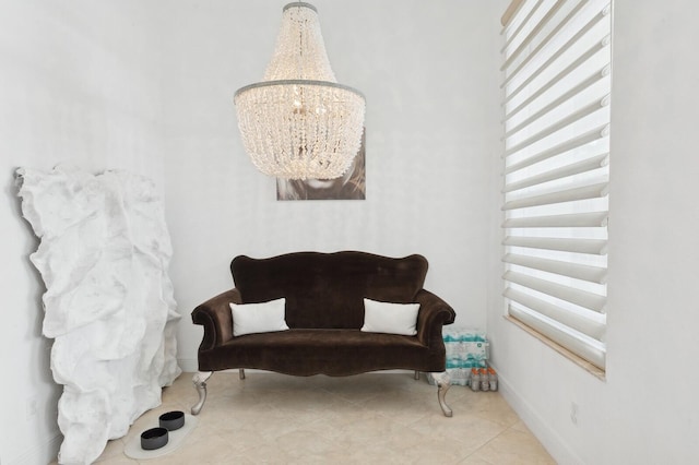 living area featuring a chandelier