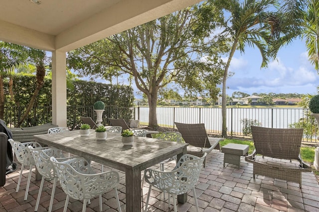 view of patio with a water view