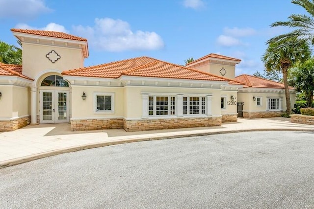 rear view of property with french doors