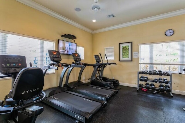 gym with ceiling fan and ornamental molding