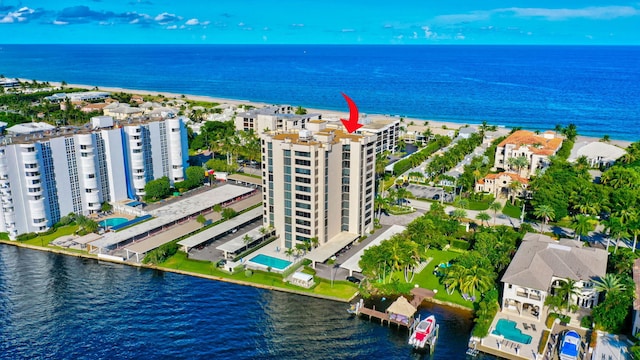 birds eye view of property with a water view