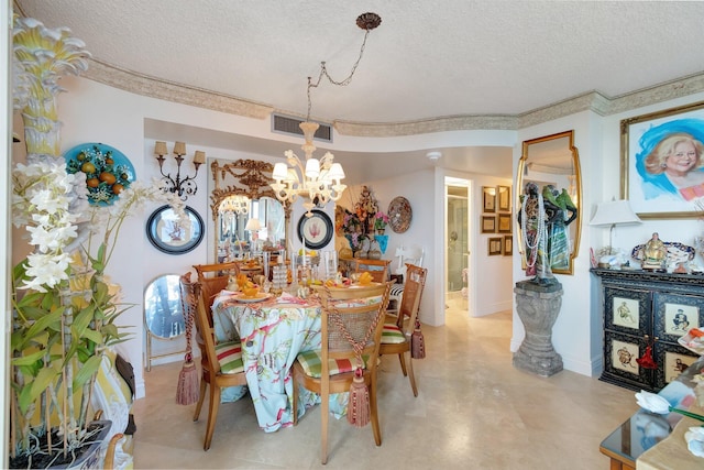 dining area featuring a textured ceiling and a notable chandelier