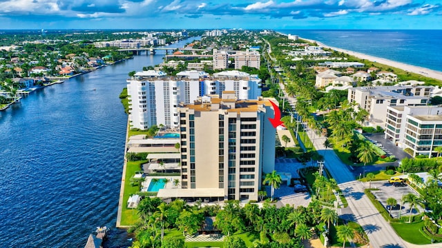 birds eye view of property with a water view