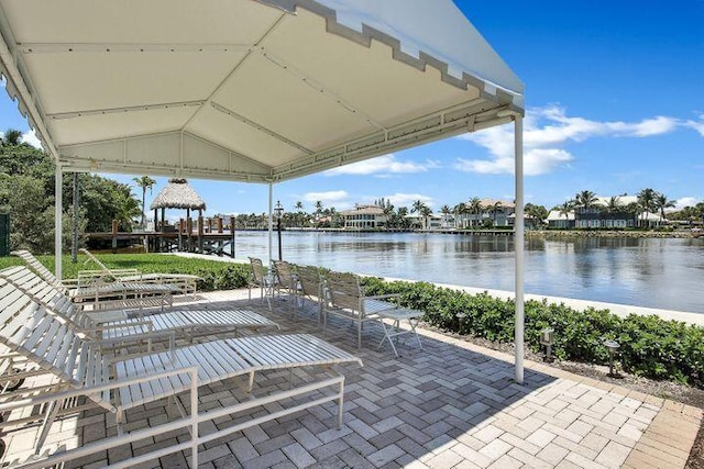 view of patio / terrace with a gazebo and a water view