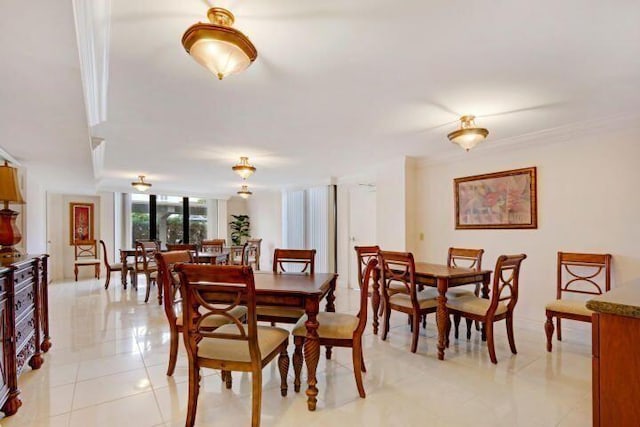 tiled dining space with ornamental molding