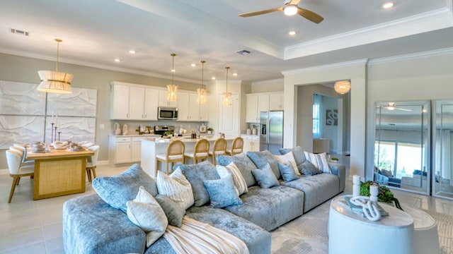 living room featuring ceiling fan, crown molding, and light tile patterned flooring