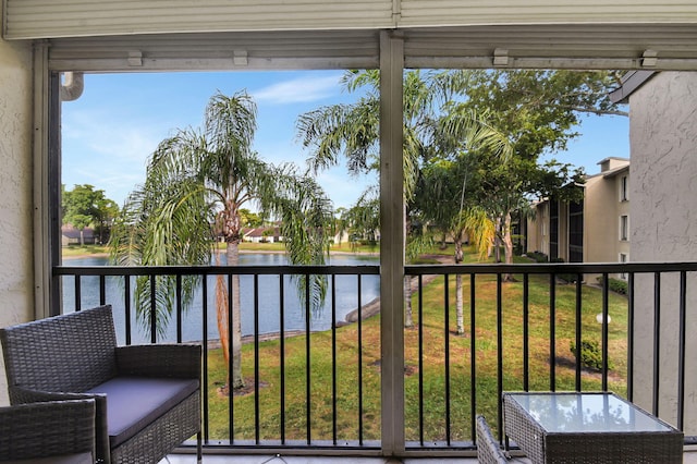 balcony featuring a water view