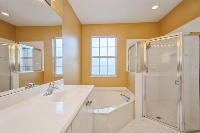 bathroom with tile patterned floors, vanity, and separate shower and tub