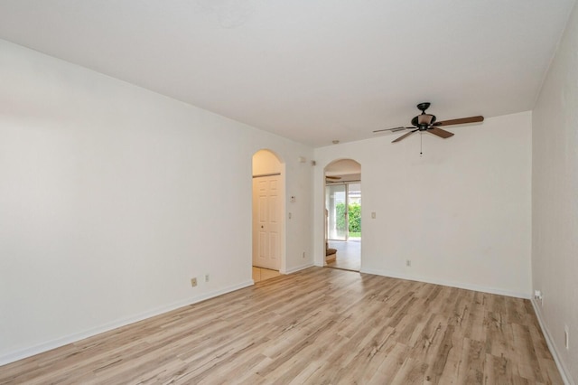 spare room featuring ceiling fan and light wood-type flooring