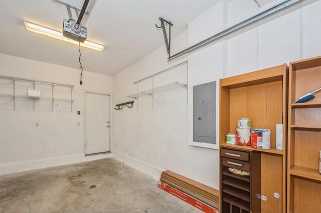 garage with a garage door opener and electric panel