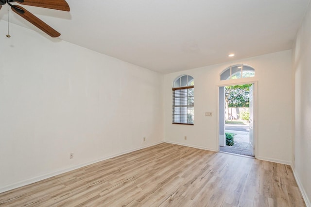 empty room with light hardwood / wood-style flooring and ceiling fan