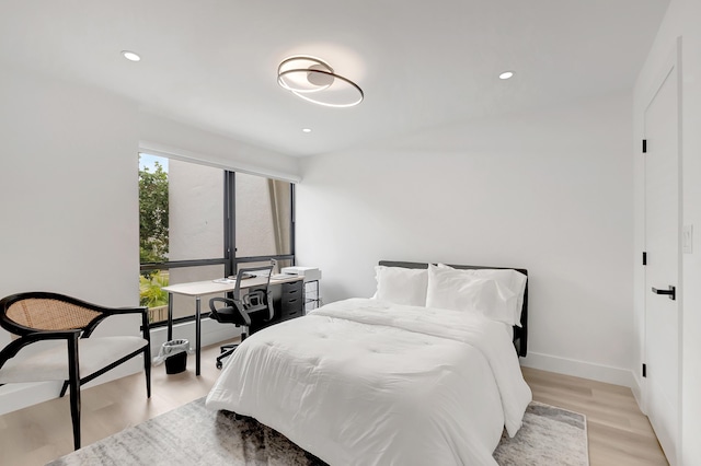 bedroom with light wood-type flooring