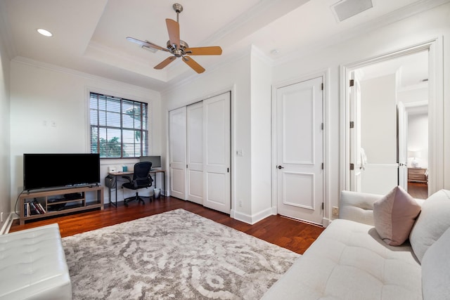 office featuring ceiling fan, dark hardwood / wood-style flooring, and ornamental molding