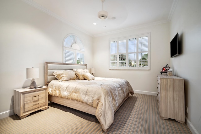 carpeted bedroom featuring ceiling fan and ornamental molding