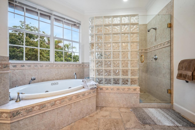 bathroom featuring plus walk in shower and ornamental molding