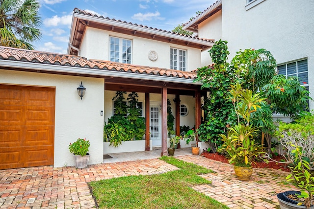 mediterranean / spanish home with a porch