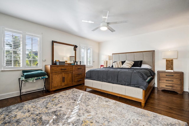 bedroom with ceiling fan and dark hardwood / wood-style flooring