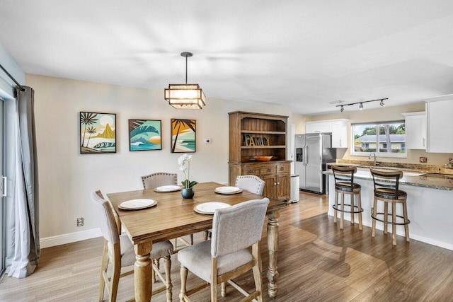 dining room with light wood-type flooring