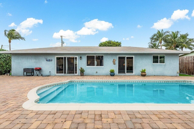 view of swimming pool with a patio