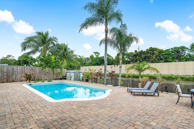 view of swimming pool with a patio