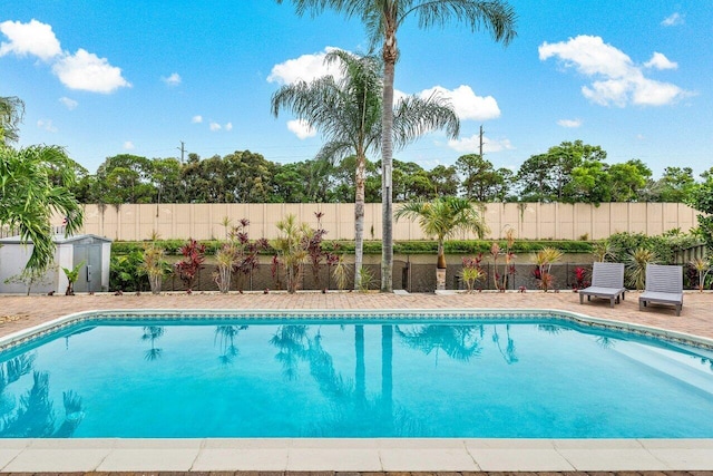 view of pool featuring a storage unit