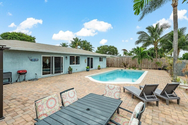 view of swimming pool with a patio