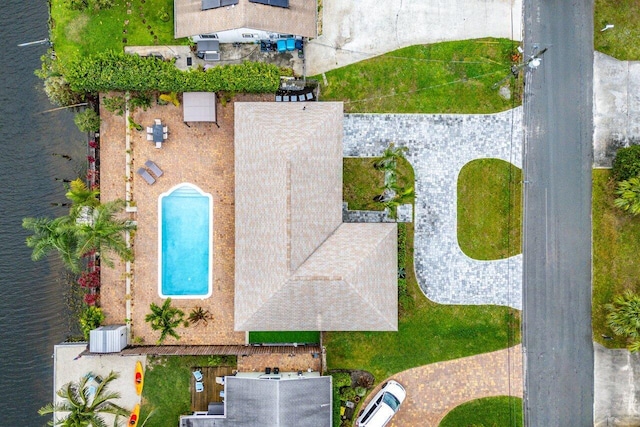 birds eye view of property with a water view