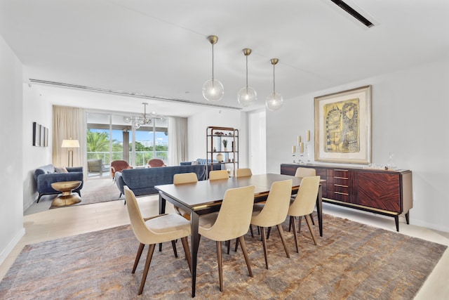 dining space featuring a notable chandelier