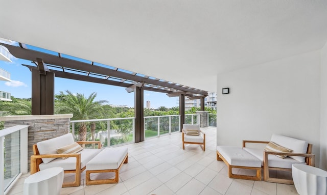 view of patio with a pergola and a balcony