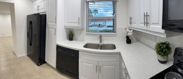 kitchen with white cabinets, sink, tasteful backsplash, and black appliances