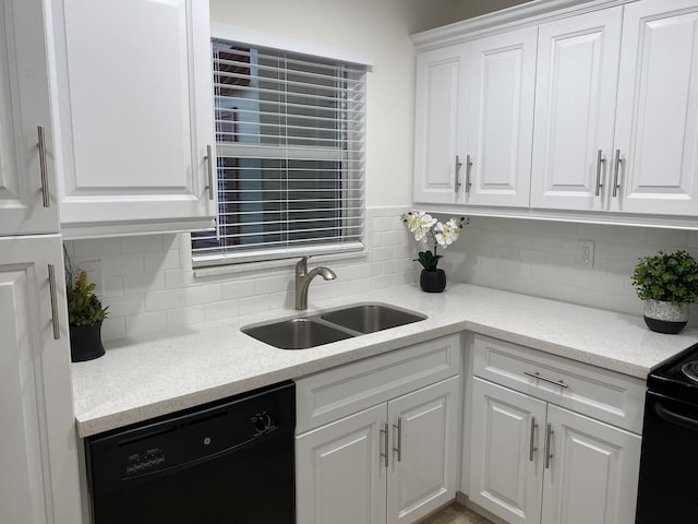 kitchen with black appliances, sink, white cabinets, and backsplash