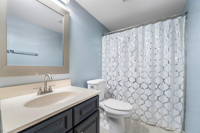 bathroom with tile patterned flooring, vanity, curtained shower, and toilet