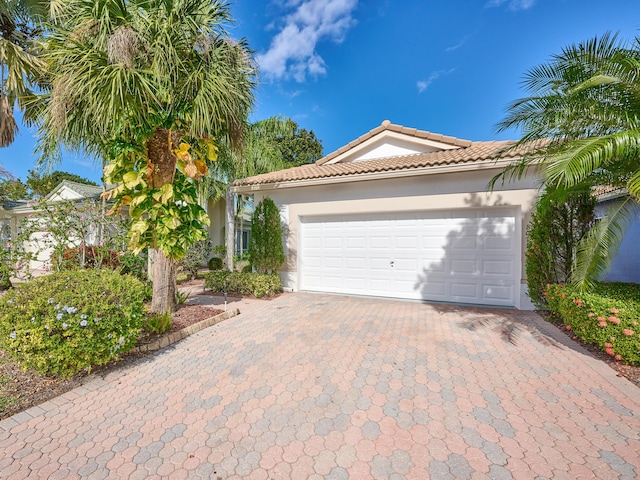 mediterranean / spanish-style house featuring a garage