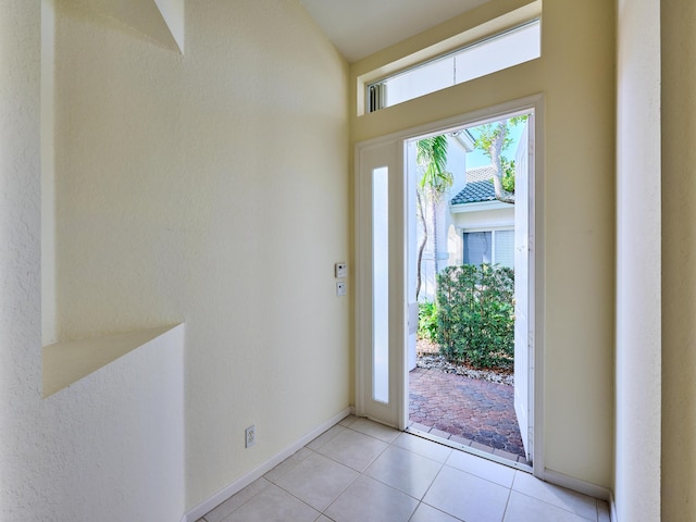 entryway with light tile patterned floors